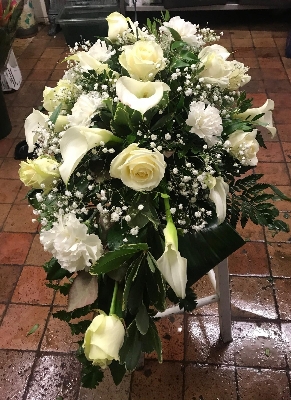 White floral casket spray